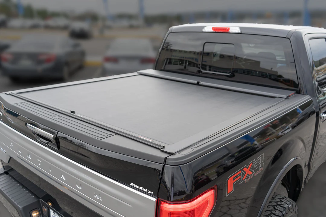 Roll-N-Lock retractable tonneau cover installed on truck bed showing locking mechanism
